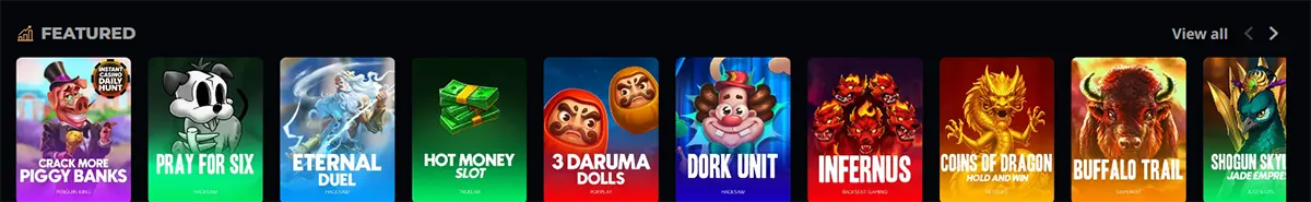 Featured slot games section with colorful thumbnails including Crack More Piggy Banks, Pray for Six, Eternal Duel, Hot Money, 3 Daruma Dolls, Dork Unit, Infernus, Coins of Dragon, Buffalo Trail, and Shogun Sky, plus a “View all” link on a dark casino interface.